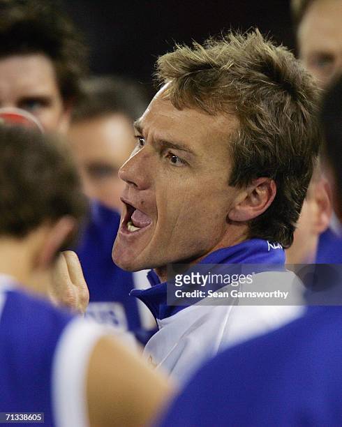 Kangaroos Coach Dean Laidley addresses his players during the round 13 AFL match between the Kangaroos and Essendon Bombers at the Telstra Dome June...