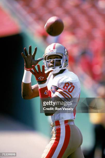 Wide receiver Jerry Rice of the San Francisco 49ers catches a pass during warmups before the game against the Kansas City Chiefs at Arrowhead Stadium...