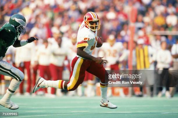 Wide receiver Art Monk of the Washington Redskins runs with a pass reception during an undated game against the Philadelphia Eagles at Veterans...