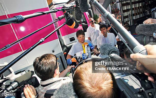 Germany's Jan Ullrich answers journalists' questions during a press conference in front of his hotel in Blaesheim near Strasbourg on the eve of the...