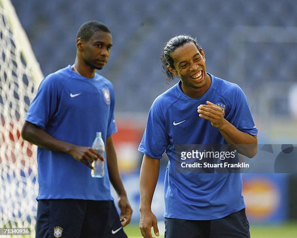 Ronaldinho of Brazil smiles and Juan of Brazil looks on during the Brazil National Football Team training session for the FIFA World Cup Germany 2006...