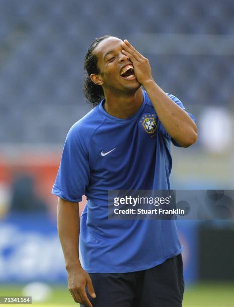 Ronaldinho of Brazil shares a joke during the Brazil National Football Team training session for the FIFA World Cup Germany 2006 at the FIFA World...