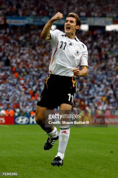 Miroslav Klose of Germany celebrates scoring an equalising goal during the FIFA World Cup Germany 2006 Quarter-final match between Germany and...