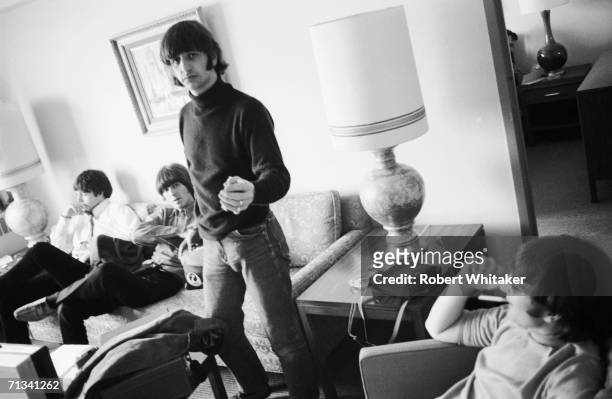 Ringo Starr offers Bob Whitaker a cigarette, while the rest of the Beatles count down the hours in Anchorage, en-route to a tour of Japan. Brian...