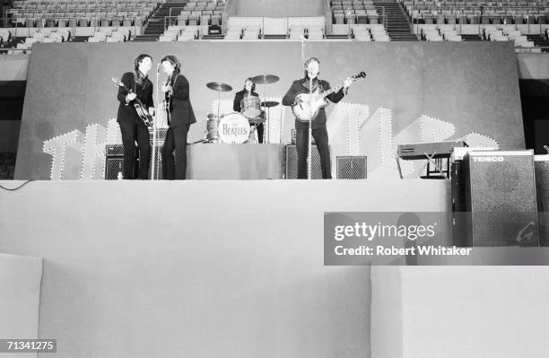 The Beatles in performance during their first show at Tokyo's Budokan Hall, 30th June 1966.