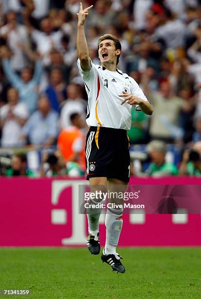 Miroslav Klose of Germany celebrates scoring an equalising goal during the FIFA World Cup Germany 2006 Quarter-final match between Germany and...