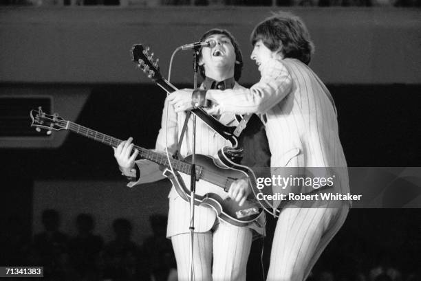 Paul McCartney and George Harrison on stage at Tokyo?s Budokan Hall, during The Beatles Asian tour, 1st July 1966.