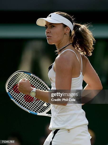 Martina Hingis of Switzerland celebrates winning a point in her match against Ai Sugiyama of Japan during day five of the Wimbledon Lawn Tennis...