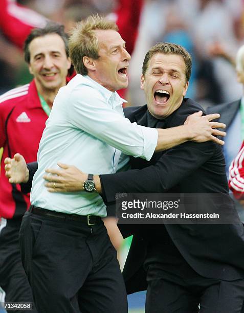 Manager of Germany Juergen Klinsmann celebrates with Oliver Bierhoff following his team's victory in a penalty shootout at the end of the FIFA World...