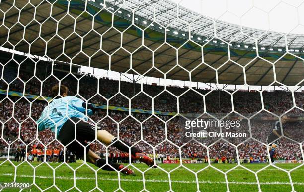Jens Lehmann of Germany saves a penalty taken by Esteban Cambiasso of Argentina in a penalty shootout during the FIFA World Cup Germany 2006...