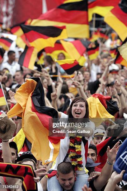 Germany soccer fans celebrate their victory in penalsty kicks against Argentina while watching the FIFA World Cup 2006 Quarter Finals match at the...