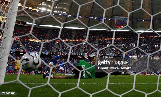 Goalkeeper Oleksandr Shovkovskyi of the Ukraine, dives in vain as Gianluci Zambrotta of Italy scores the opening goal during the FIFA World Cup...