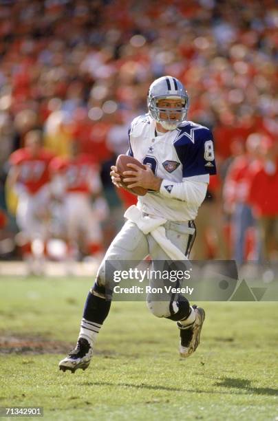 Quarterback Troy Aikman of the Dallas Cowboys rolls out against the San Francisco 49ers during the 1994 NFC Championship at Candlestick Park on...