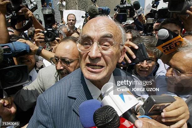 Former Mexican President Luis Echeverria is surrounded by the press 09 July 2002 while coming out of the Special Office of the public prosecutor for...