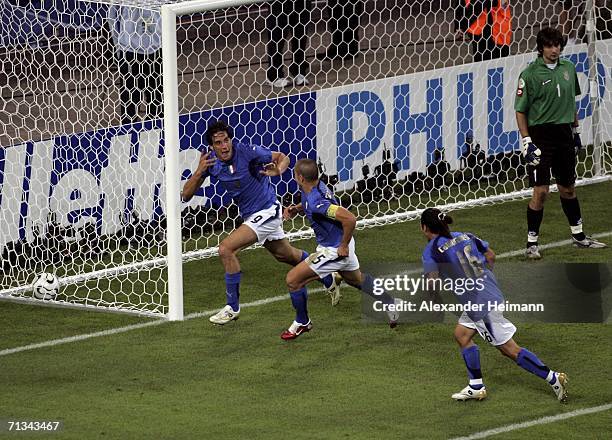 Luca Toni of Italy, celebrates with teammates after scoring his team's second goal during the FIFA World Cup Germany 2006 Quarter-final match between...