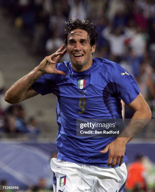 Luca Toni of Italy, celebrates after scoring his team's second goal during the FIFA World Cup Germany 2006 Quarter-final match between Italy and...