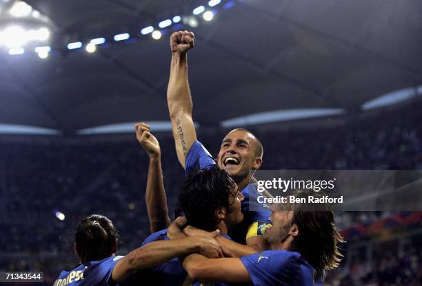 Luca Toni of Italy, celebrates with teammate Fabio Cannavaro and Andrea Pirlo, after scoring his team's second goal during the FIFA World Cup Germany...