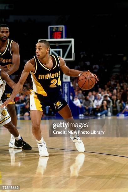 Jonathan Bender of the Indiana Pacers drives to the basket against the Golden State Warriors during a game circa 1999-2005 at the Arena In Oakland,...