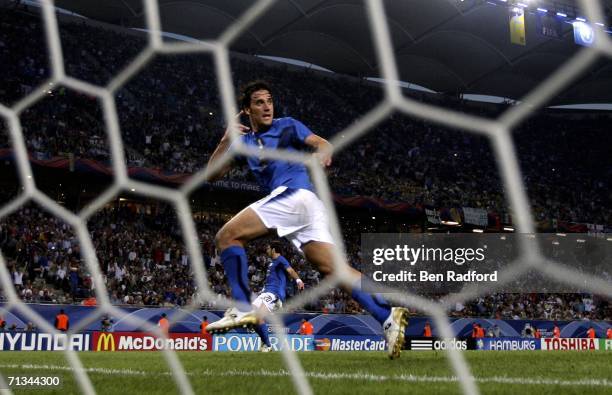 Luca Toni of Italy turns away to celebrate, after scoring his team's third goal during the FIFA World Cup Germany 2006 Quarter-final match between...