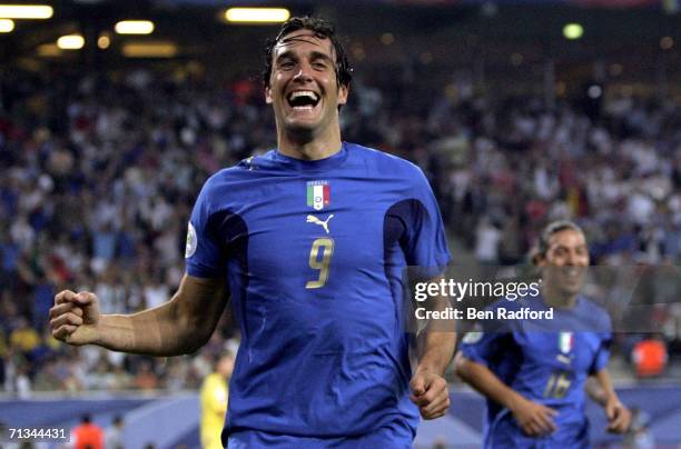 Luca Toni of Italy, celebrates after scoring his team's second goal during the FIFA World Cup Germany 2006 Quarter-final match between Italy and...