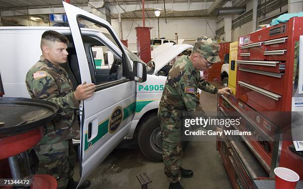 Specialist, Mike Valencia of the Arizona National Guard?s 180th Field Artillery unit and his Sergeant, Ken Hager, who both live in Tucson, prepare to...