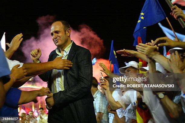 Vlado Buchkovski, Macedonian prime minister and the leader of the ruling party SDSM, greets fans at an election rally in Skopje, 30 June 2006....