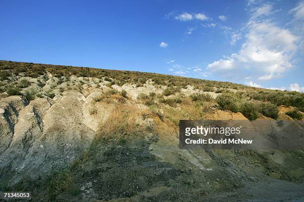 The San Andreas Fault, visible as the line between grey metamorphic quartz monzonite and brown sedimentary sandstone and siltstone, is seen at Tejon...
