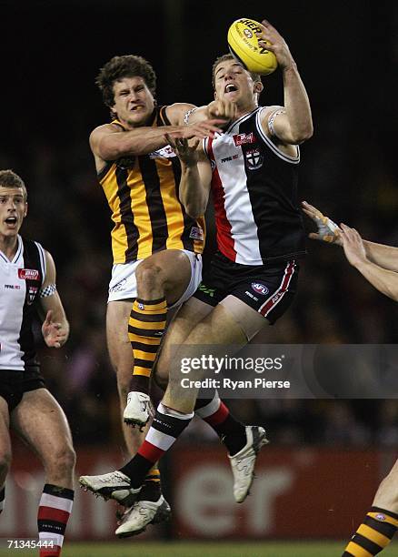 Matt Maguire of the Saints competes for the ball against Campbell Brown of the Hawks during the round thirteen AFL match between the St Kilda Saints...