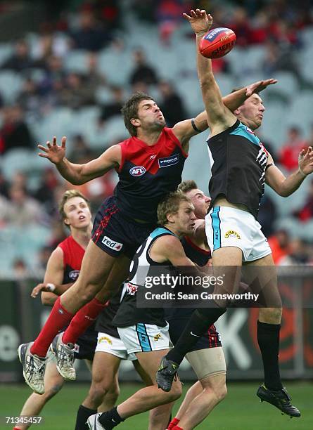 Mark Jamar for Melbourne and Brendon Lade for the Power in action during the round 13 AFL match between Melbourne and Port Adelaide at the Melbourne...