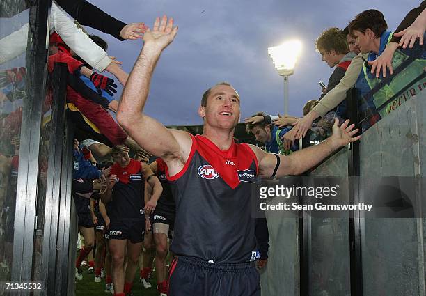 David Neitz for Melbourne celebrates after winning the round thirteen AFL match between Melbourne and Port Adelaide at the Melbourne Cricket Ground...