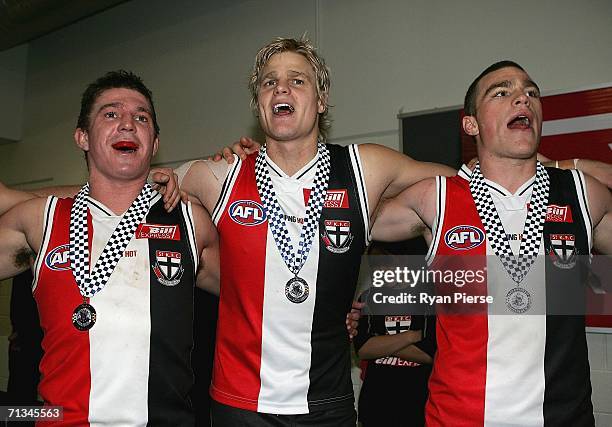 Steven Baker, Nick Riewoldt and Leigh Fisher of the Saints sing the club song after the round 13 AFL match between the St Kilda Saints and the...