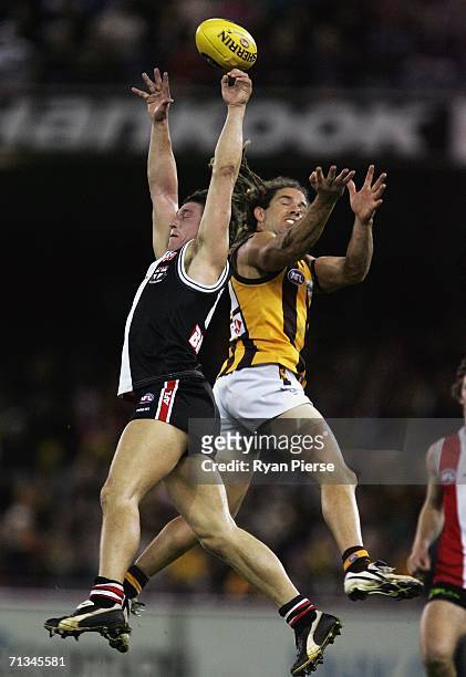 Steven Baker of the Saints competes for the ball against Chance Bateman of the Hawks during the round thirteen AFL match between the St Kilda Saints...