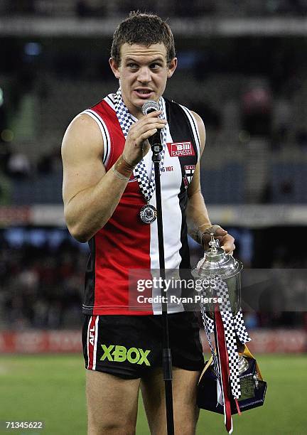 Luke Ball of the Saints accepts the Silk-Miller Cup after the round thirteen AFL match between the St Kilda Saints and the Hawthorn Hawks at the...
