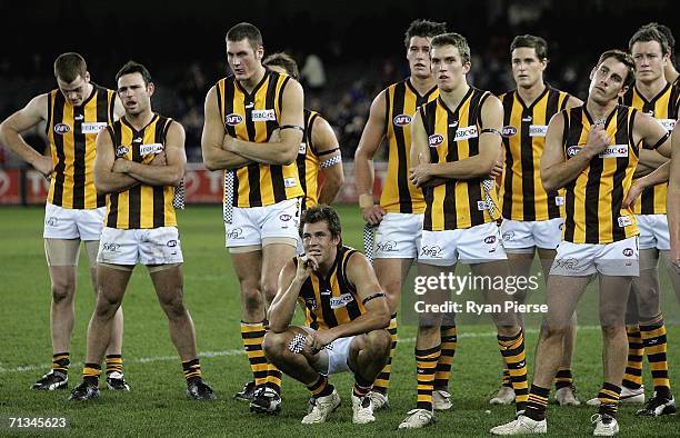 Hawks players look dejected after the round 13 AFL match between the St Kilda Saints and the Hawthorn Hawks at the Telstra Dome July 1, 2006 in...