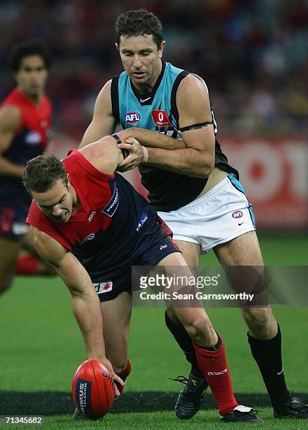 Brad Green for Melbourne and Brendon Lade for the Power in action during the round thirteen AFL match between Melbourne and Port Adelaide at the...