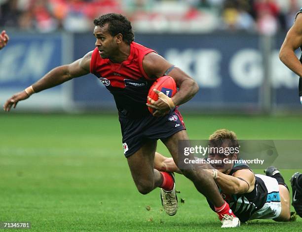 Byron Pickett for Melbourne in action during the round thirteen AFL match between Melbourne and Port Adelaide at the Melbourne Cricket Ground on July...