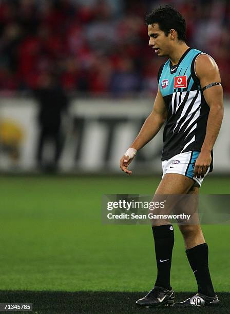 Danyle Pearce for the Power leaves the ground dejected after losing the round thirteen AFL match between Melbourne and Port Adelaide at the Melbourne...