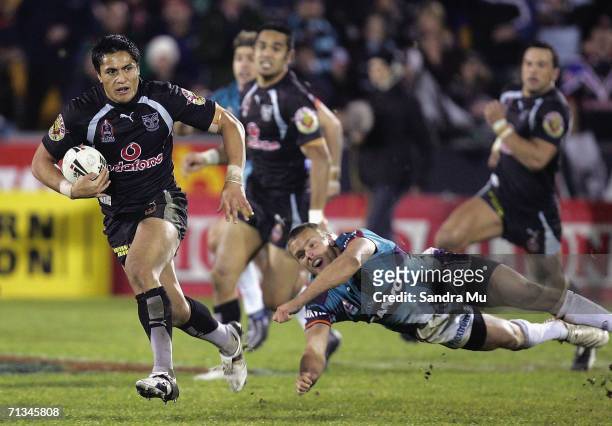 Nick Youngquest of Penrith misses making a tackle on Jerome Ropati of the Warriors during the NRL round 17 match between the Warriors and the Penrith...