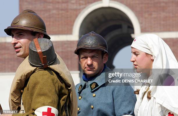 People clad in WWI military and nurse uniforms pose at the Memorial of Thiepval, northern France, 01 July 2006, during a day of commemorations to...