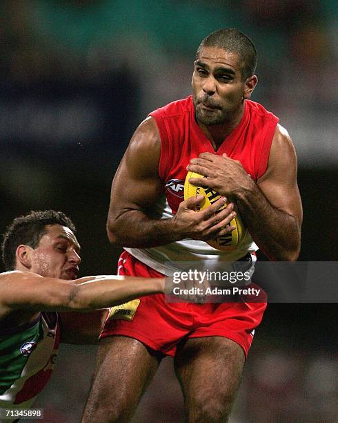 Michael O'Loughlin of the Swans marks during the round 13 AFL match between the Sydney Swans and the Fremantle Dockers at the Sydney Cricket Ground...