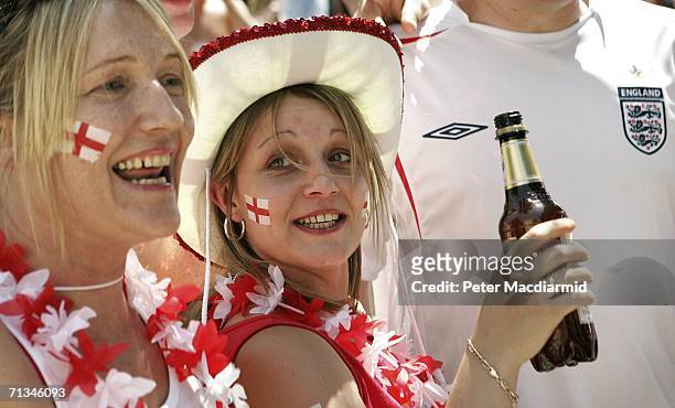 English football fans drink a beer ahead of their team's quarter final match with Portugal on July 1, 2006 in Gelsenkirchen, Germany.
