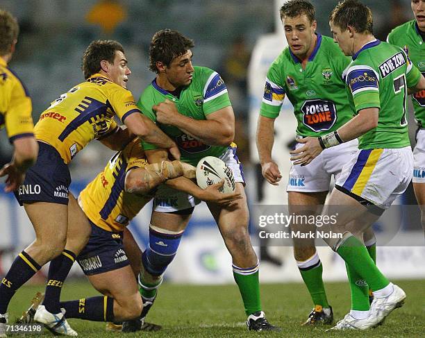Tom Learoyd-Lahrs of the Raiders tries to offload during the round 17 NRL match between the Canberra Raiders and the Parramatta Eels played at...
