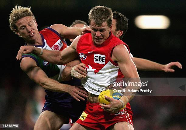 Ryan O'Keefe of the Swans is tackled during the round 13 AFL match between the Sydney Swans and the Fremantle Dockers at the Sydney Cricket Ground...