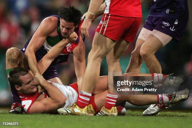Amon Buchanan of the Swans has an altercation with Steven Dodd of the Dockers the AFL Round thirteen match between the Sydney Swans and the Fremantle...