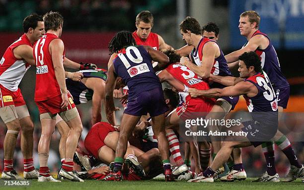 Amon Buchanan of the Swans has an altercation with Steven Dodd of the Dockers during the round 13 AFL match between the Sydney Swans and the...