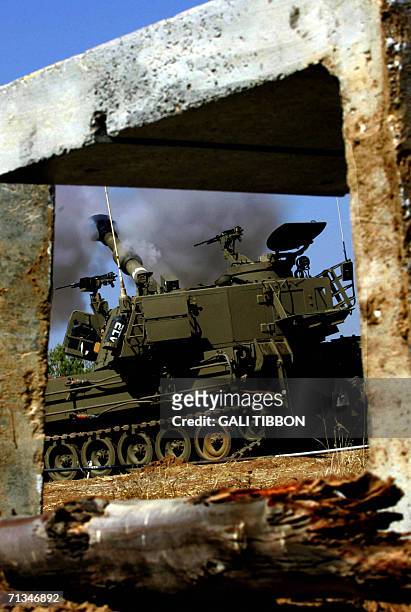 An Israeli mobile artillery unit fires towards the Gaza Strip from a staging area near Kibbutz Nahal Oz, just outside the northern borders of the...