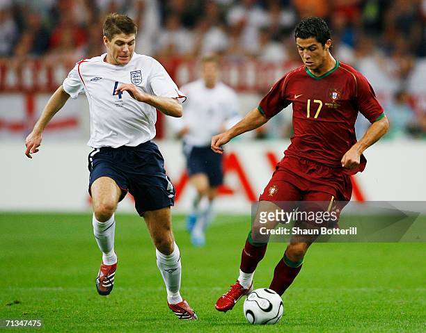 Cristiano Ronaldo of Portugal is pursued by Steven Gerrard of England during the FIFA World Cup Germany 2006 Quarter-final match between England and...
