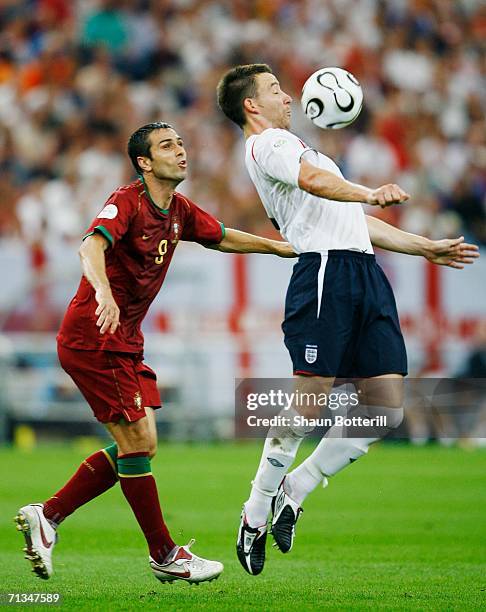 John Terry of England beats Pauleta of Portugal to the ball during the FIFA World Cup Germany 2006 Quarter-final match between England and Portugal...