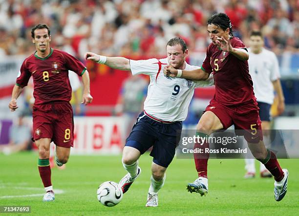Fernando Meira of Portugal challenges Wayne Rooney of England during the FIFA World Cup Germany 2006 Quarter-final match between England and Portugal...