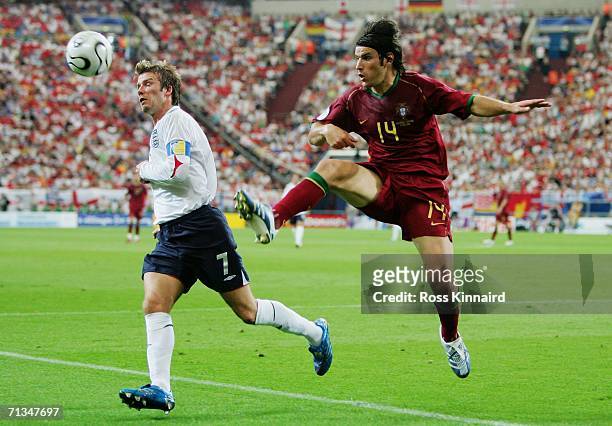Nuno Valente of Portugal battles for the ball with David Beckham of England during the FIFA World Cup Germany 2006 Quarter-final match between...